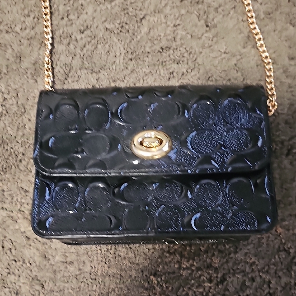 Coach Black and Gold Crossbody Bag with Embossed Pattern